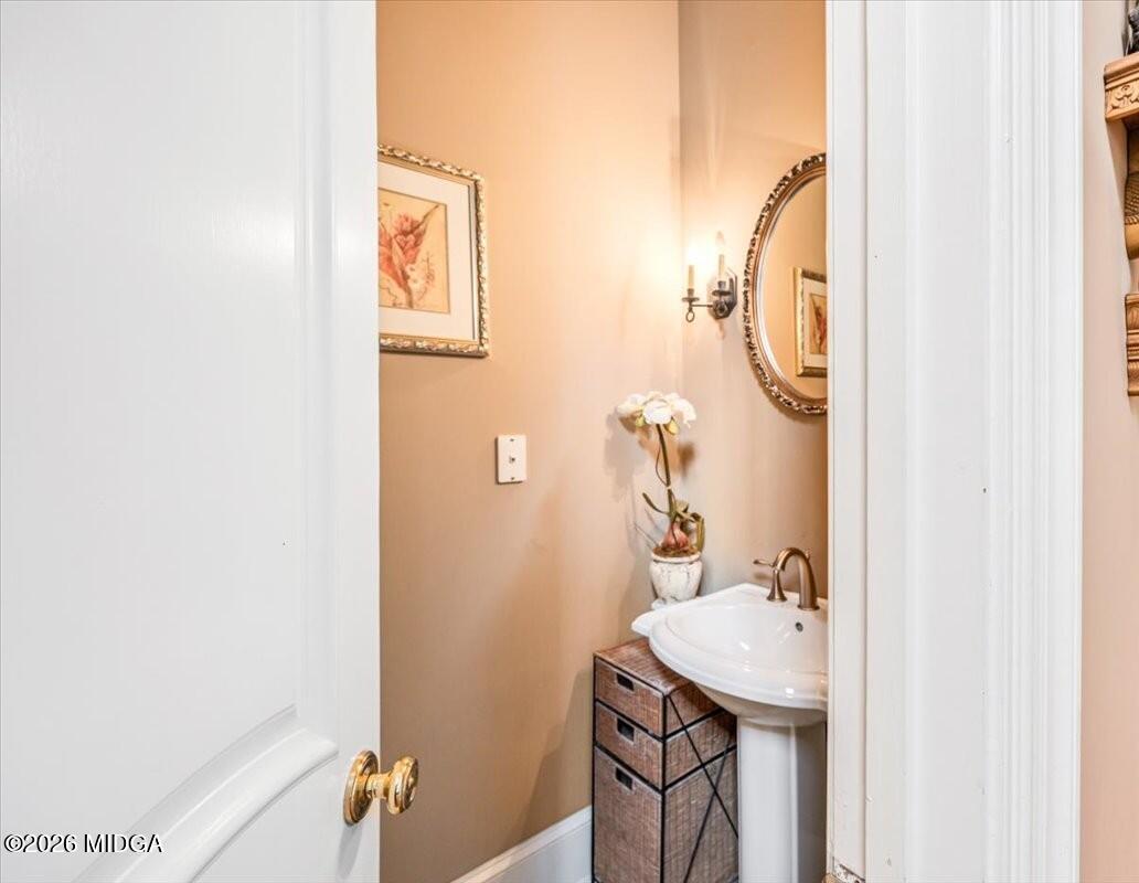 311 North Rivoli Farms Drive Macon, GA 31210 - Photo 19 of 79 a bathroom with a sink and mirror