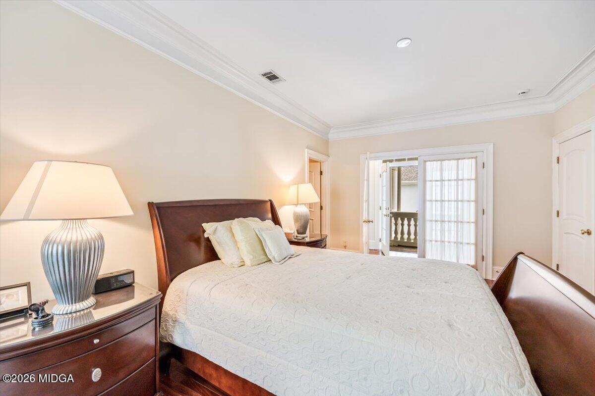311 North Rivoli Farms Drive Macon, GA 31210 - Photo 22 of 79 a bedroom with a bed and chair