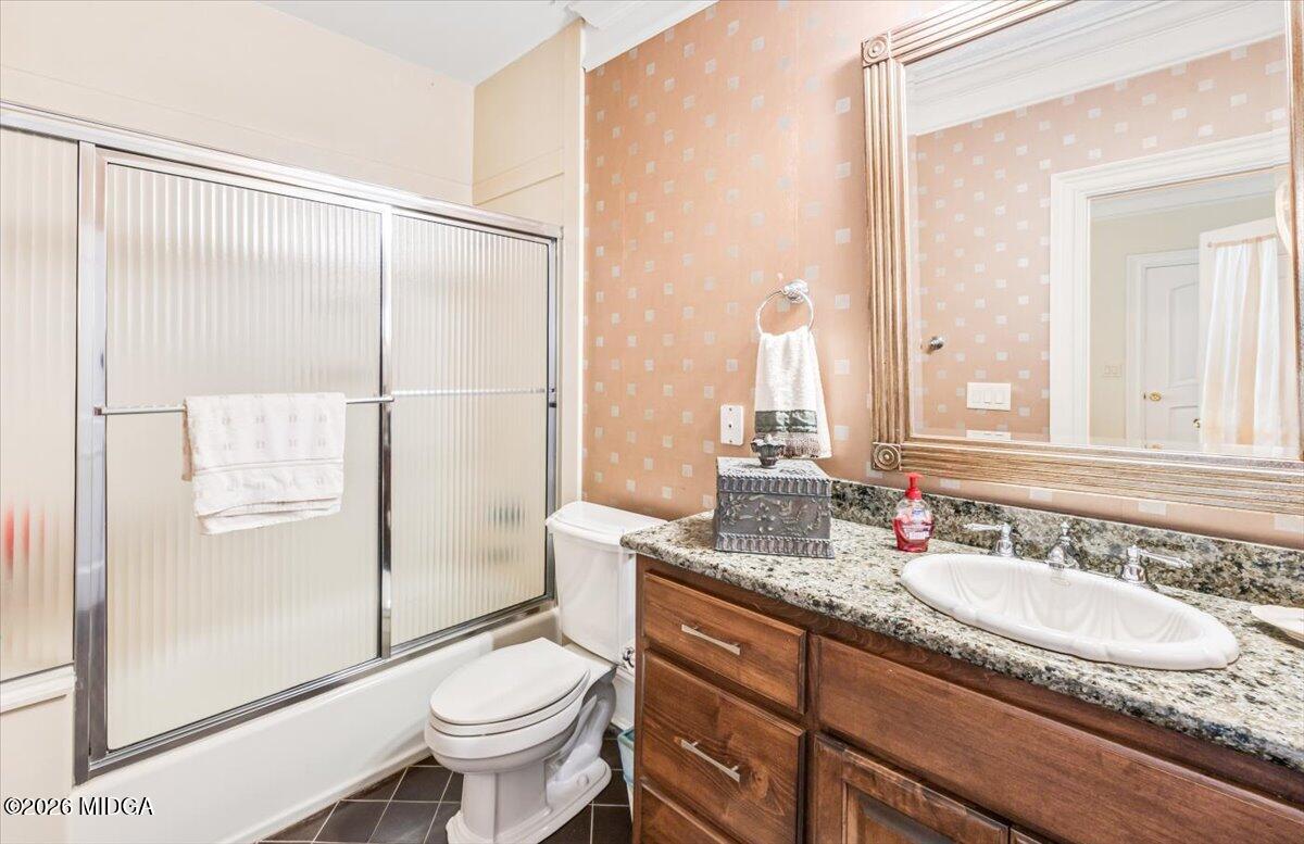 311 North Rivoli Farms Drive Macon, GA 31210 - Photo 23 of 79 a bathroom with a granite countertop sink toilet and shower