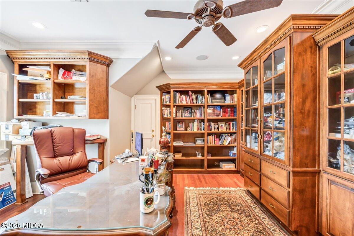 311 North Rivoli Farms Drive Macon, GA 31210 - Photo 28 of 79 a living room with furniture a rug and a book shelf