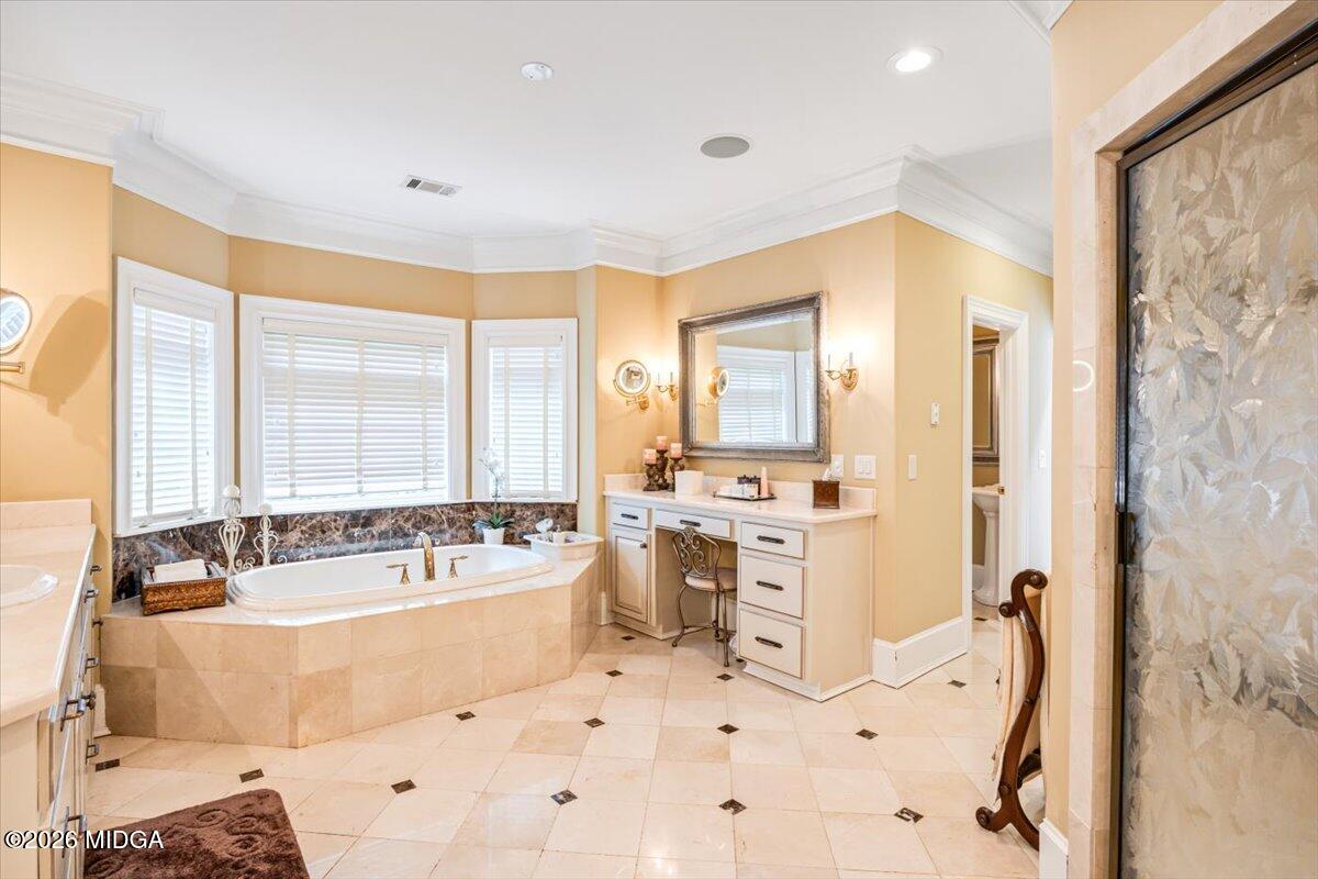311 North Rivoli Farms Drive Macon, GA 31210 - Photo 31 of 79 a spacious bathroom with a tub sink and mirror