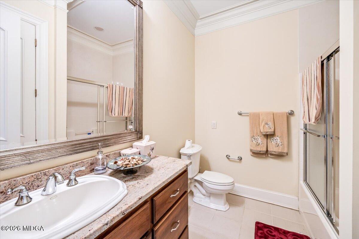 311 North Rivoli Farms Drive Macon, GA 31210 - Photo 49 of 79 a bathroom with a sink a toilet and shower curtain