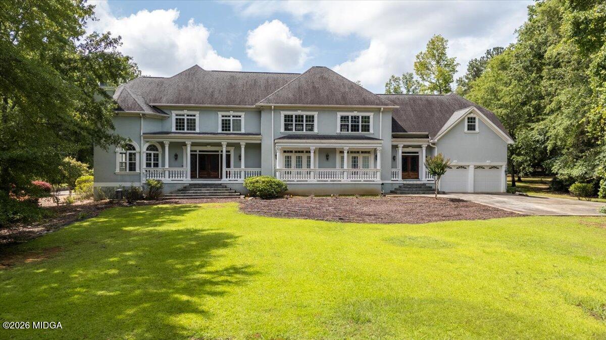 311 North Rivoli Farms Drive Macon, GA 31210 - Photo 66 of 79 a front view of a house with swimming pool having outdoor seating