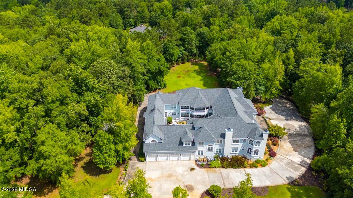311 North Rivoli Farms Drive Macon, GA 31210 - Photo 71 of 79 an aerial view of residential houses with yard and swimming pool