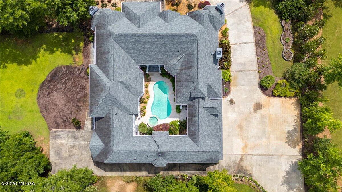 311 North Rivoli Farms Drive Macon, GA 31210 - Photo 75 of 79 an aerial view of a house with a garden and swimming pool