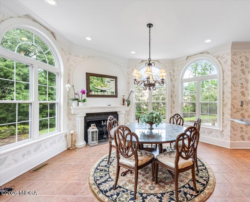 311 North Rivoli Farms Drive Macon, GA 31210 - Photo 8 of 79 a dining room with furniture a chandelier and wooden floor