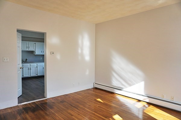 252 Ash Street, Unit 2 Waltham, MA 02453 - Photo 8 of 9 a view of an empty room and window