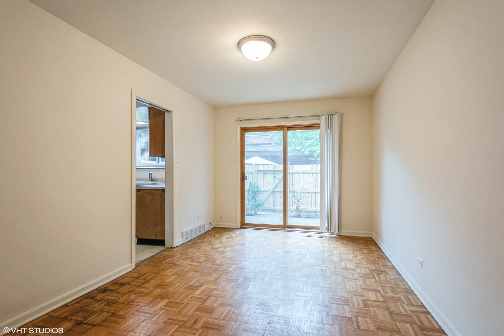 1324 Tinker Way, Unit D Glenview, IL 60025 - Photo 4 of 8 a view of an empty room with a window