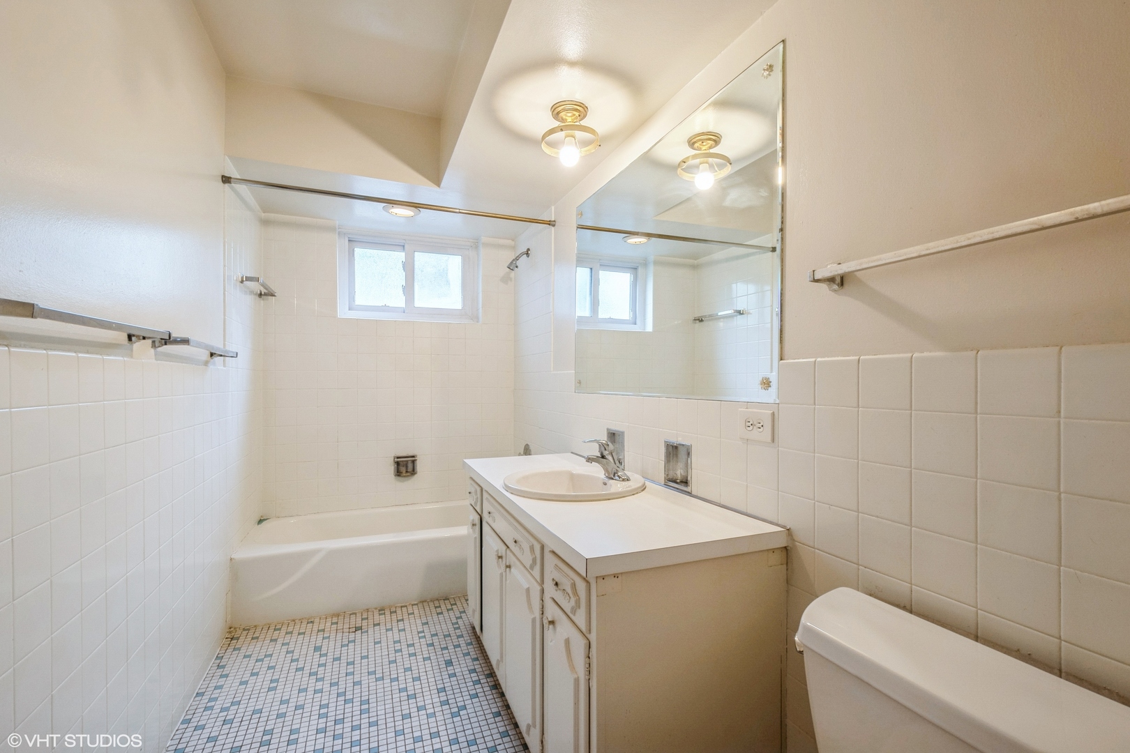 1324 Tinker Way, Unit D Glenview, IL 60025 - Photo 7 of 8 a bathroom with a sink a toilet and shower
