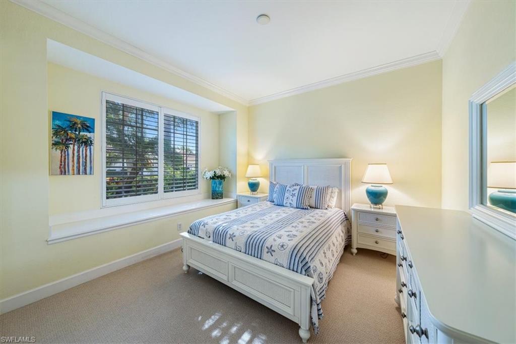 352 Steerforth Court Naples, FL 34110 - Photo 13 of 35 a bedroom with a bed and window
