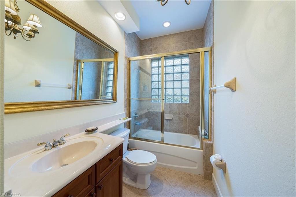 352 Steerforth Court Naples, FL 34110 - Photo 14 of 35 a bathroom with a sink a toilet and shower
