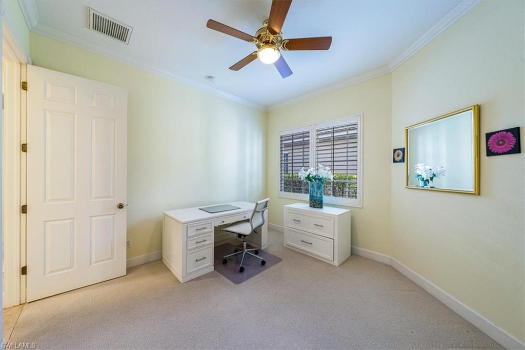 352 Steerforth Court Naples, FL 34110 - Photo 16 of 35 a view of workspace with wooden floor and ceiling fan