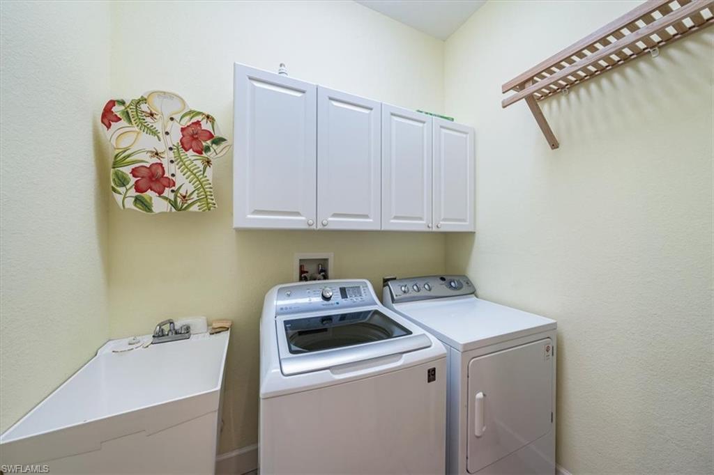 352 Steerforth Court Naples, FL 34110 - Photo 20 of 35 a utility room with dryer and washer