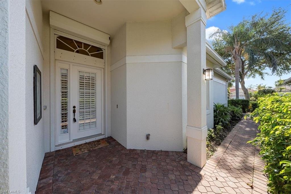 352 Steerforth Court Naples, FL 34110 - Photo 2 of 35 a view of a car garage door