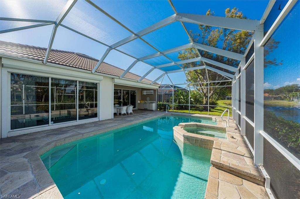 352 Steerforth Court Naples, FL 34110 - Photo 21 of 35 a view of a backyard with table and chairs potted plants