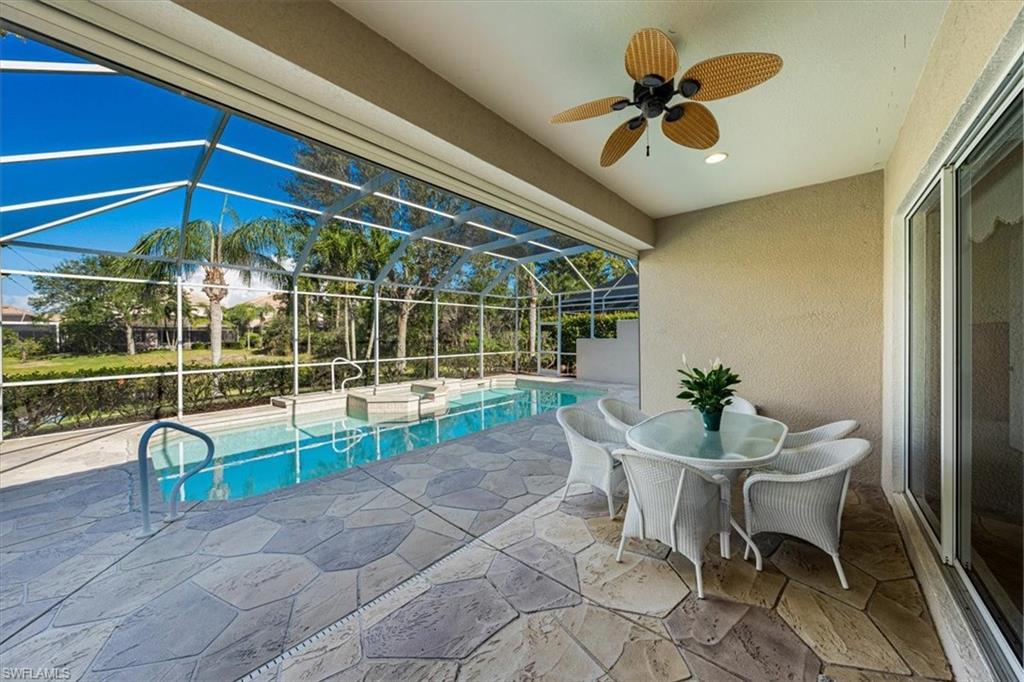 352 Steerforth Court Naples, FL 34110 - Photo 23 of 35 a view of a dining room with a table and chairs