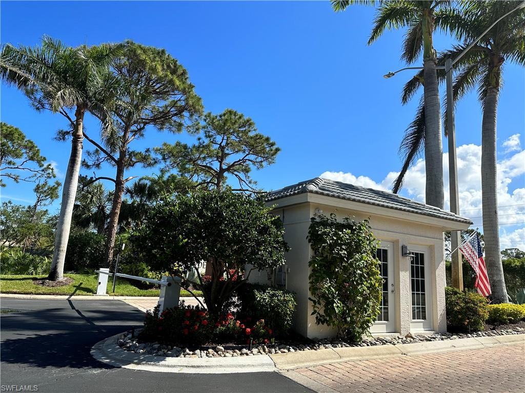 352 Steerforth Court Naples, FL 34110 - Photo 27 of 35 front view of a house with a tree in front of it