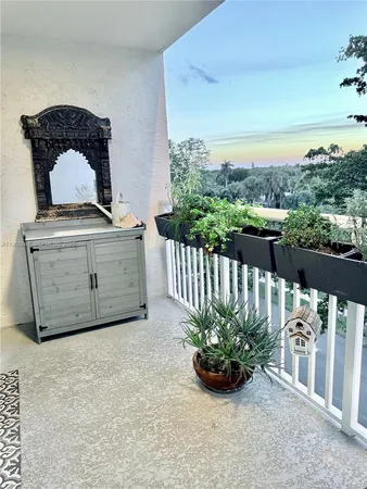 a view of a garden from a balcony