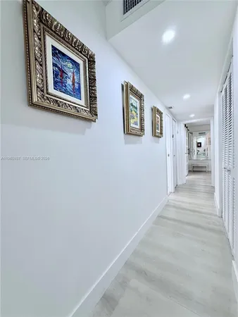 a view of a hallway with an entryway