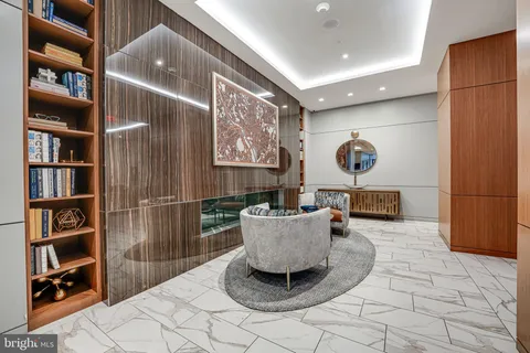 a living room with furniture and a rug