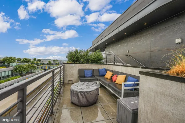 a view of balcony with furniture