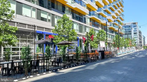an outdoor space with seating space and deck area