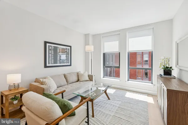 a living room with furniture and a window