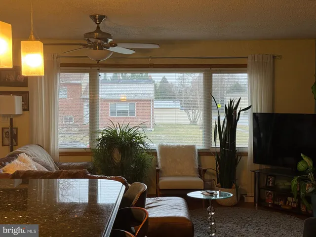a view of a livingroom with furniture and window