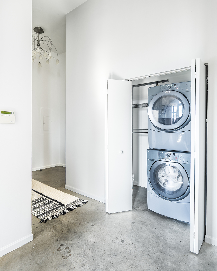 3631 North Halsted Street, Unit 308 Chicago, IL 60613 - Photo 17 of 20 a view of washer and dryer in a utility room