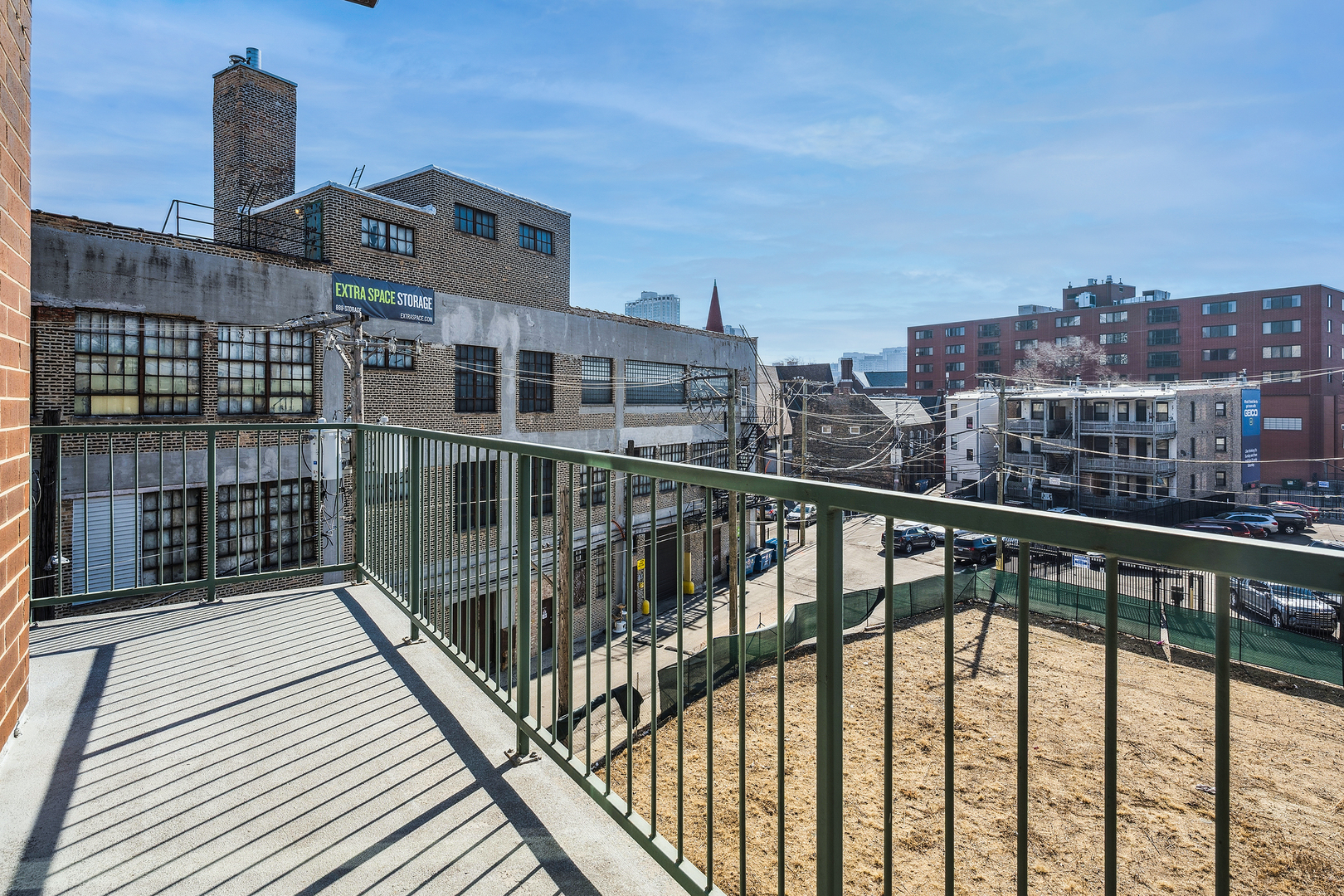3631 North Halsted Street, Unit 308 Chicago, IL 60613 - Photo 19 of 20 a view of city from a balcony