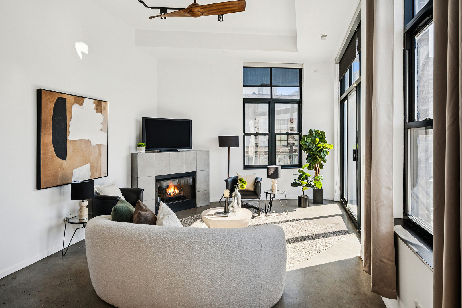 3631 North Halsted Street, Unit 308 Chicago, IL 60613 - Photo 5 of 20 a living room with furniture a fireplace and a flat screen tv
