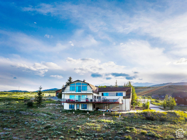 588 Raspberry Patch Road Garden City, UT 84028 - Photo 5 of 74 Rear view of house with a mountain view