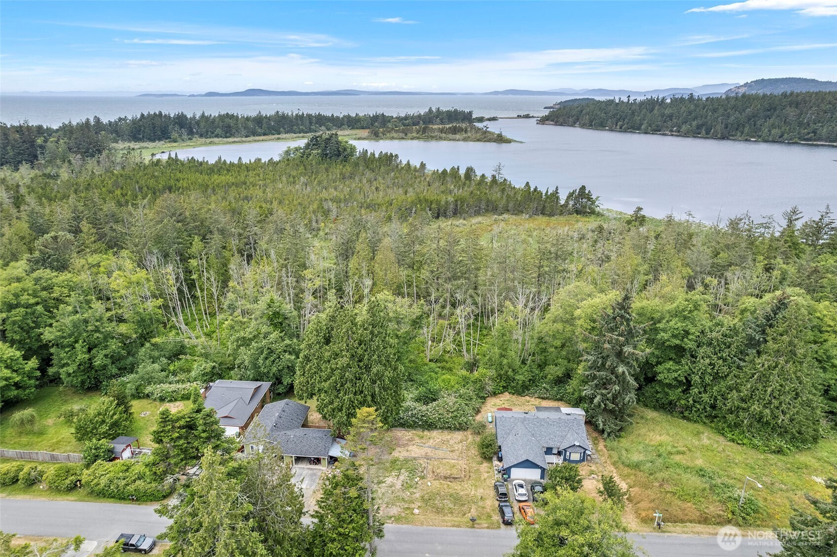 5002 Deception Circle Oak Harbor, WA 98277 - Photo 7 of 8 an aerial view of residential building with outdoor space and lake view