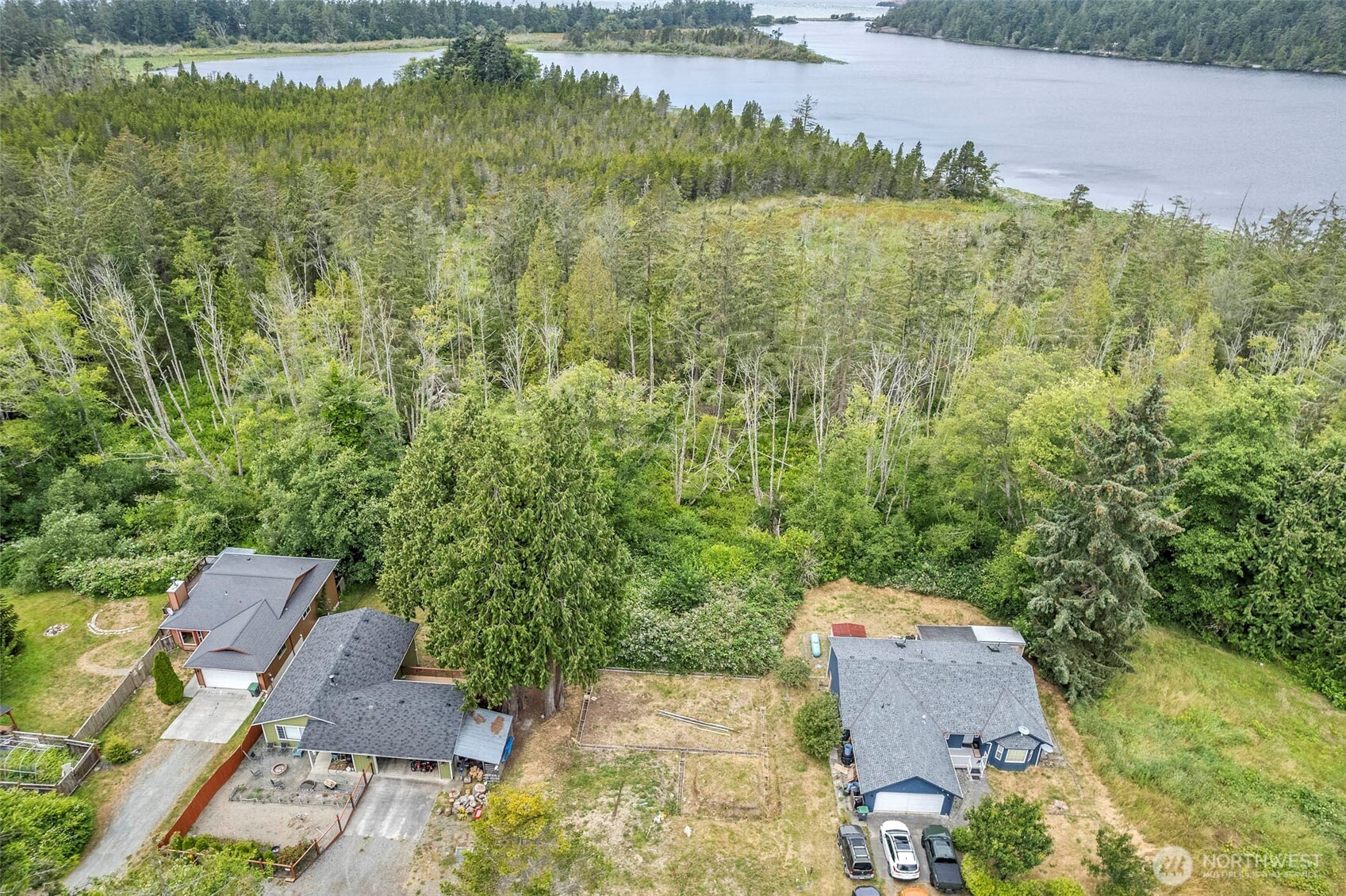 5002 Deception Circle Oak Harbor, WA 98277 - Photo 8 of 8 an aerial view of residential house with outdoor space and trees all around