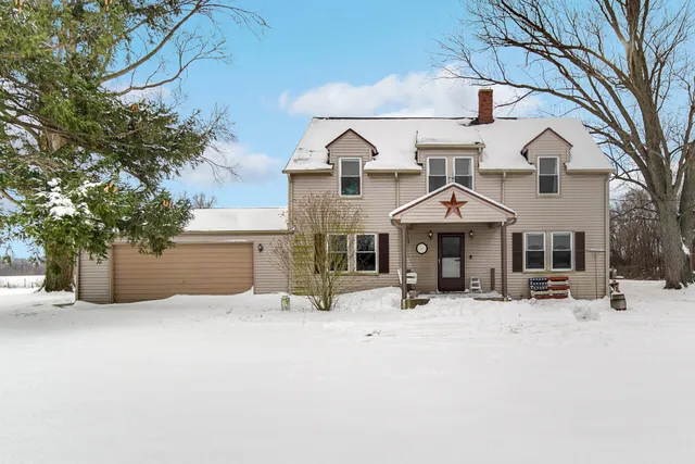 a view of a house with a snow in front of it
