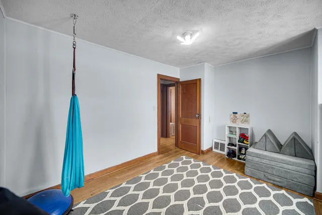 a bedroom with bed and a window