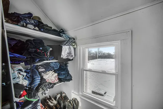 a view of a closet with storage