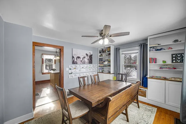 a dining room with furniture and window