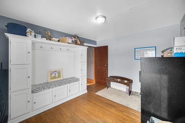 a bedroom with a bed and cabinets