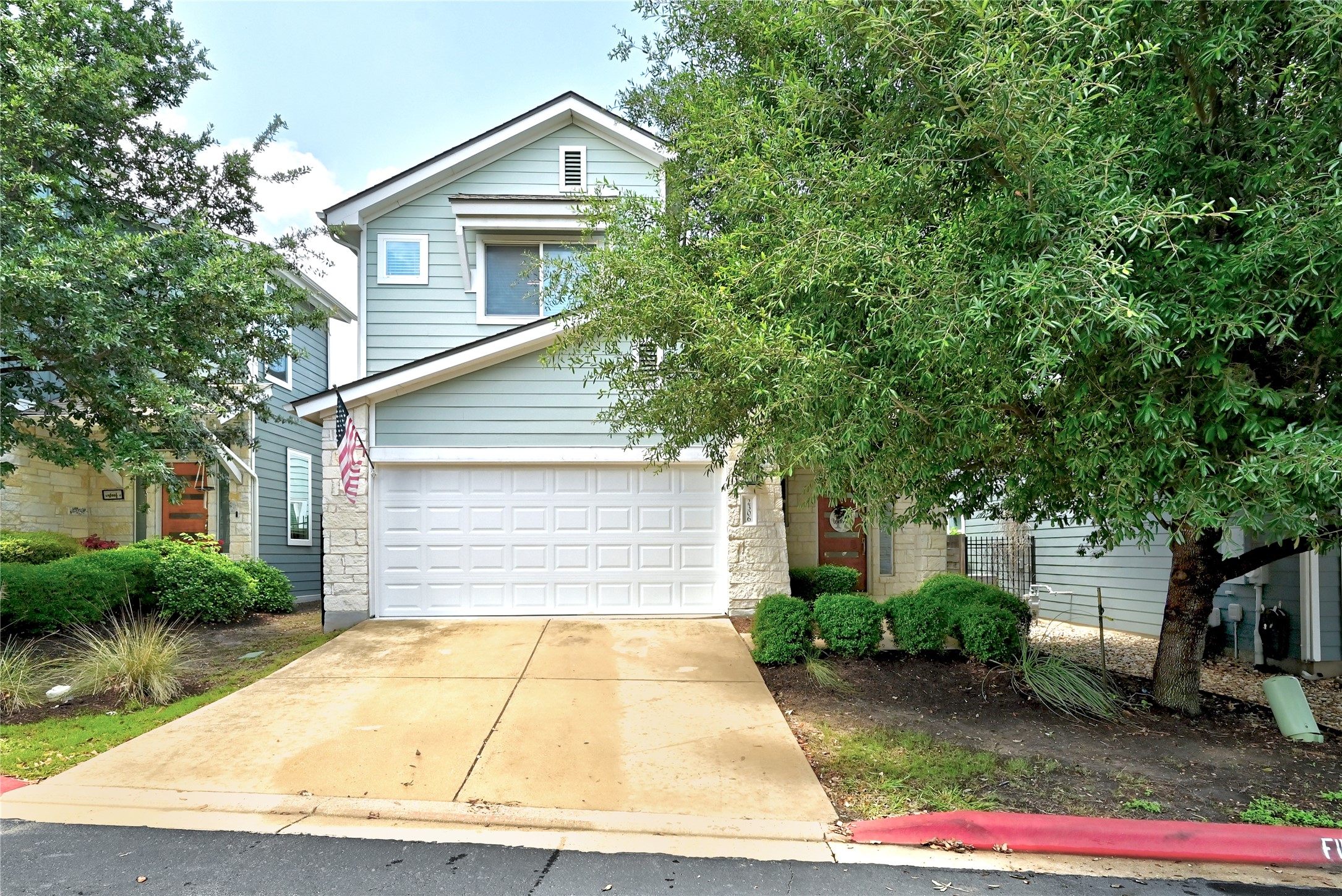 2306 Capulet Street Austin, TX 78741 - Photo 2 of 21 a house with trees in front of it