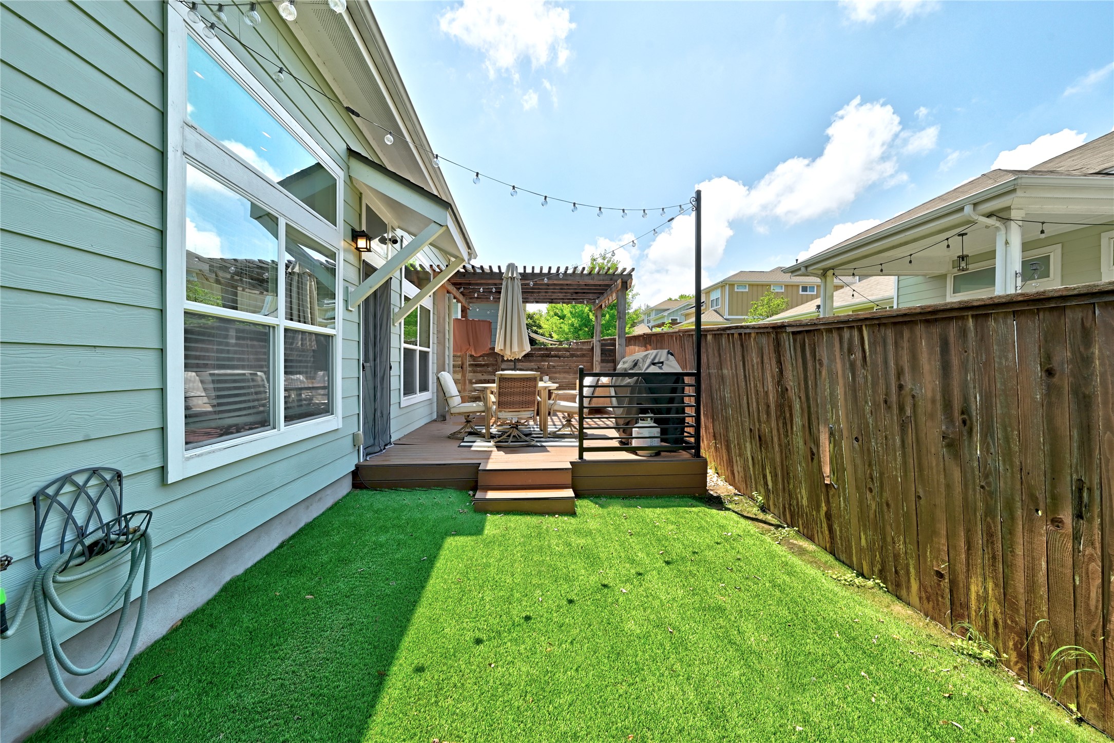 2306 Capulet Street Austin, TX 78741 - Photo 21 of 21 a backyard of a house with table and chairs