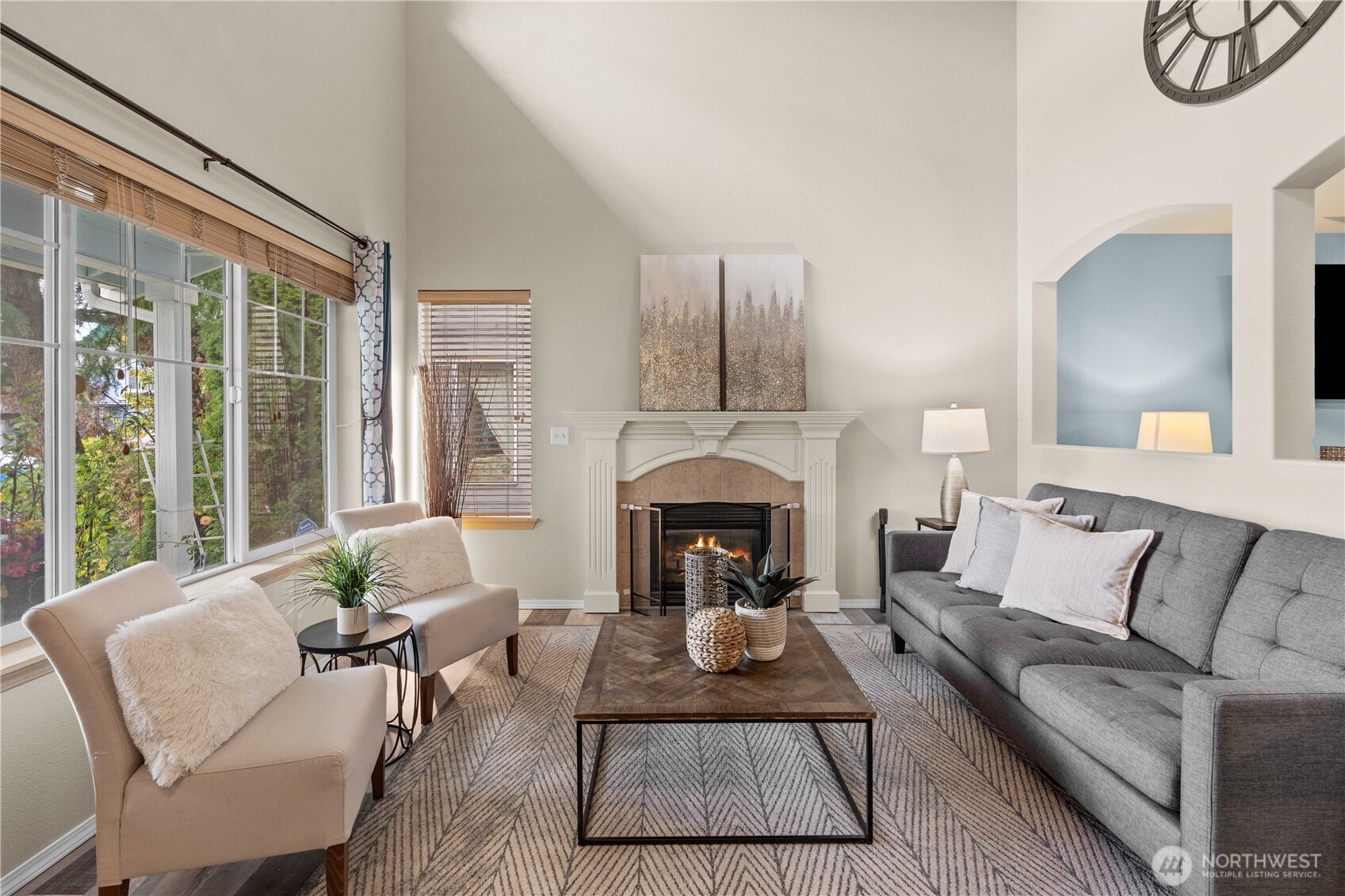 16107 Southeast 255th Place Covington, WA 98042 - Photo 3 of 30 a living room with furniture a large window and a fireplace