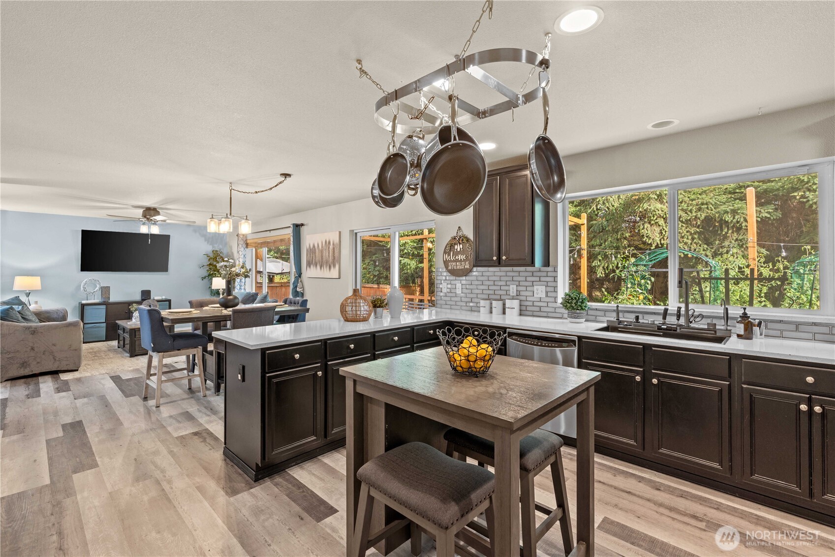 16107 Southeast 255th Place Covington, WA 98042 - Photo 10 of 30 a kitchen with a table and chairs in it