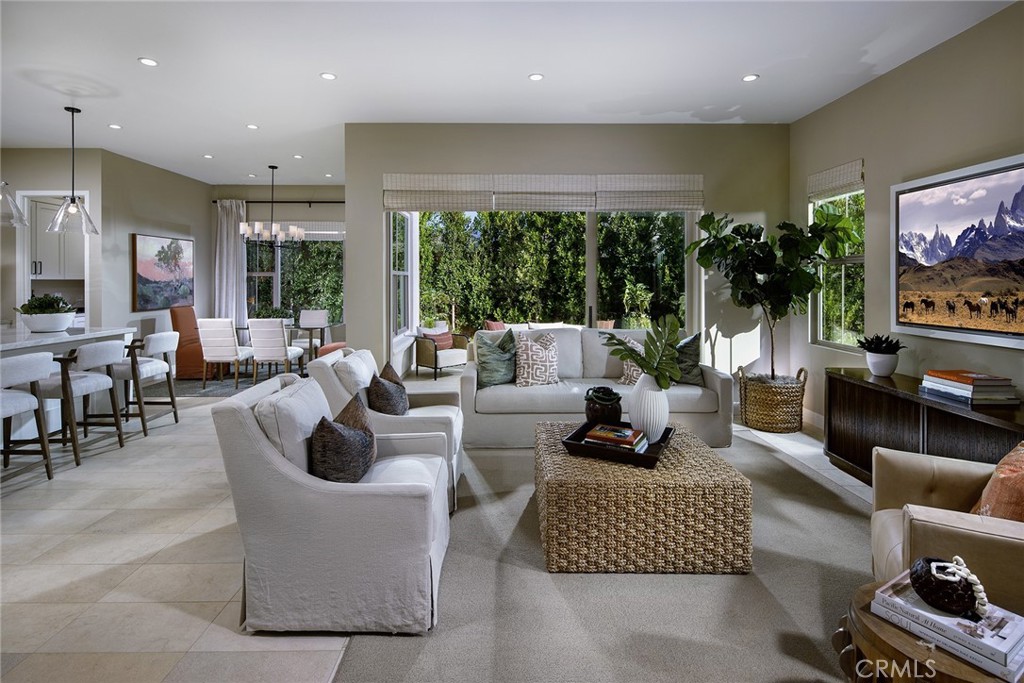 a living room with fireplace furniture and a flat screen tv