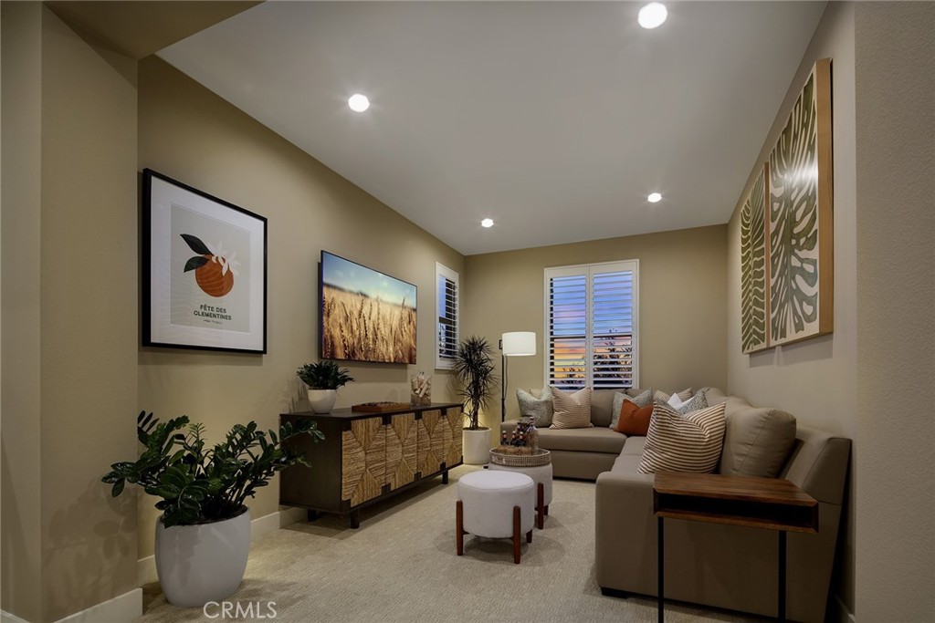105 EVERSEDGE Irvine, CA 92618 - Photo 6 of 8 a living room with furniture and a flat screen tv
