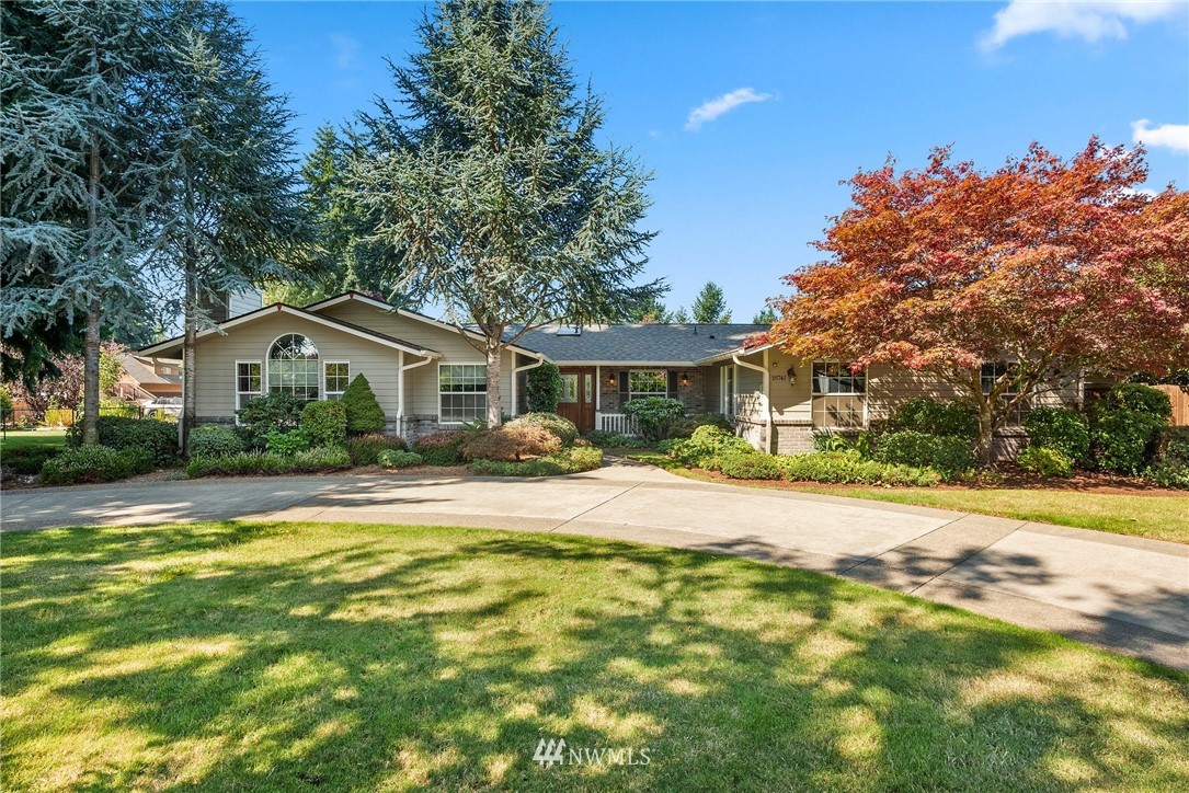 18741 Nutmeg Street Southwest Rochester, WA 98579 - Photo 1 of 39 a front view of house with yard and trees in the background