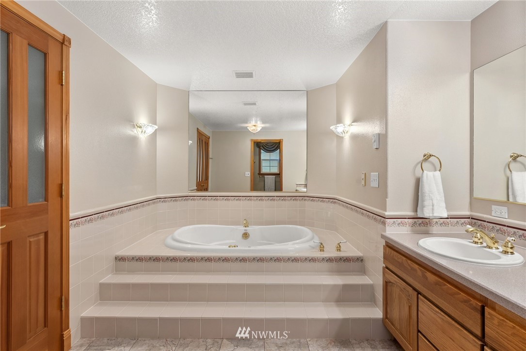 18741 Nutmeg Street Southwest Rochester, WA 98579 - Photo 13 of 39 a bathroom with a sink and a mirror