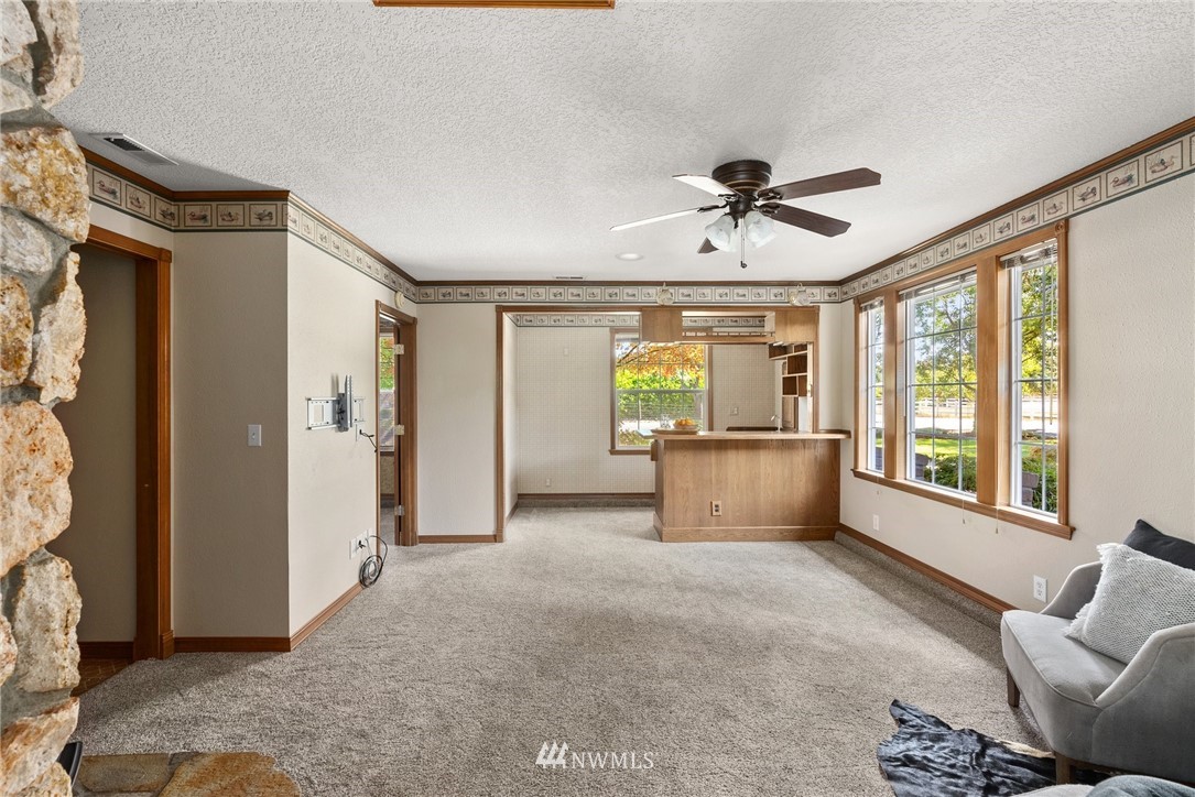 18741 Nutmeg Street Southwest Rochester, WA 98579 - Photo 20 of 39 a living room with furniture and a window