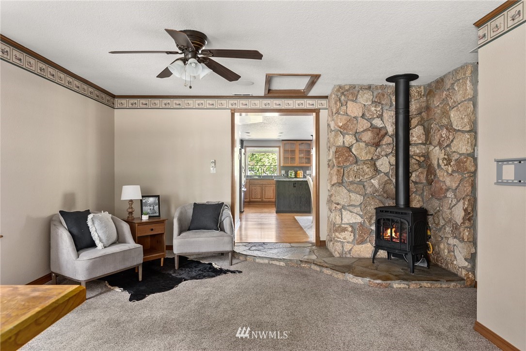 18741 Nutmeg Street Southwest Rochester, WA 98579 - Photo 22 of 39 a living room with furniture and a fireplace