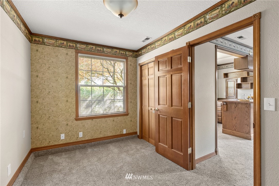 18741 Nutmeg Street Southwest Rochester, WA 98579 - Photo 23 of 39 an empty room with windows